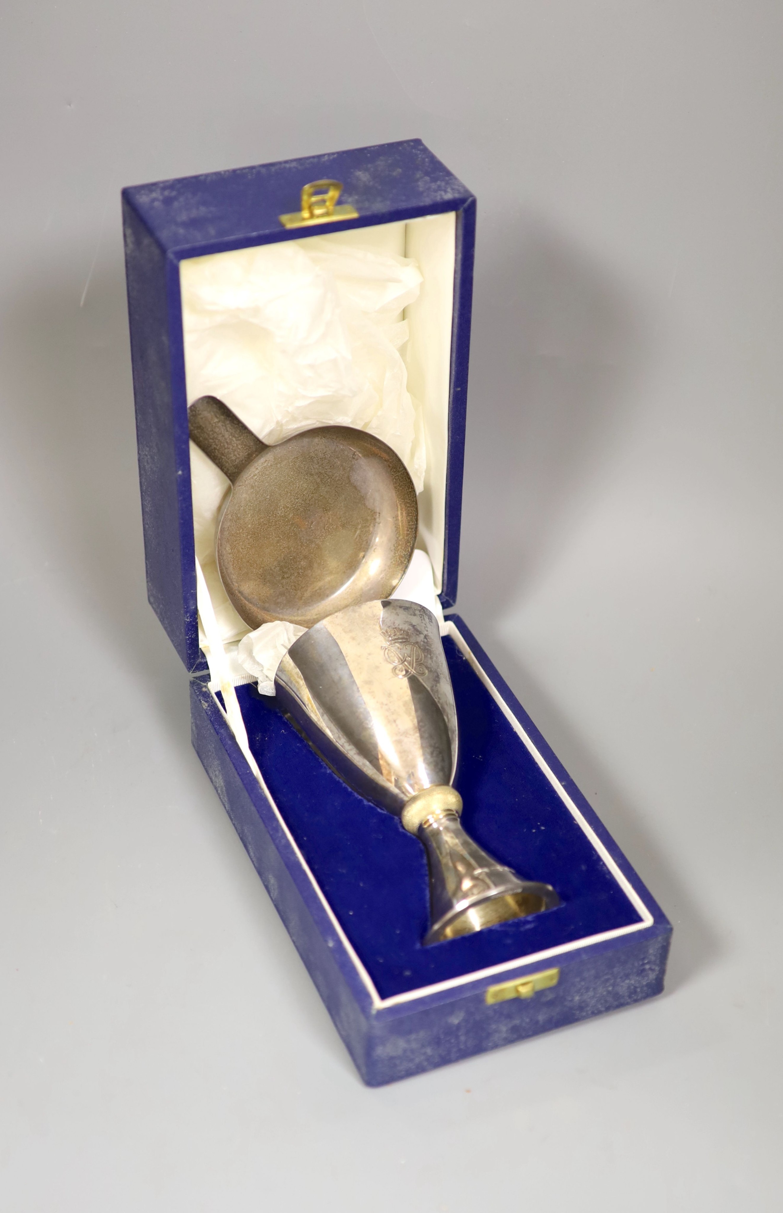 A Mappin and Webb silver and silver gilt goblet to commemorate “Silver Wedding Queen and Duke of Edinburgh 1947-1972” (London 1972), 14.4cm boxed together with Asprey silver ashtray with matchbox holder, gross 10oz.